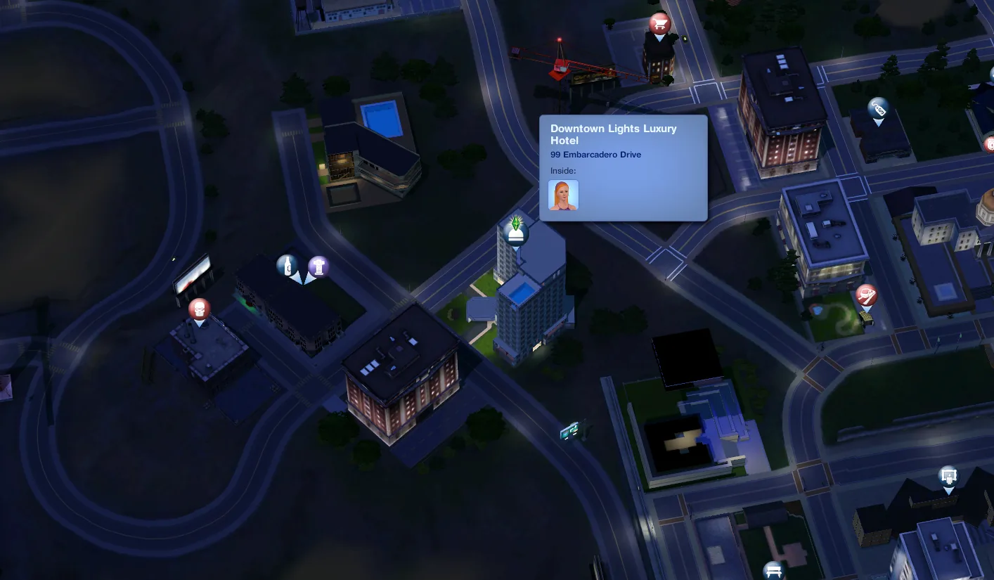 The town map at night showing the Downtown Lights Luxury Hotel with its own map tag and a guest inside.