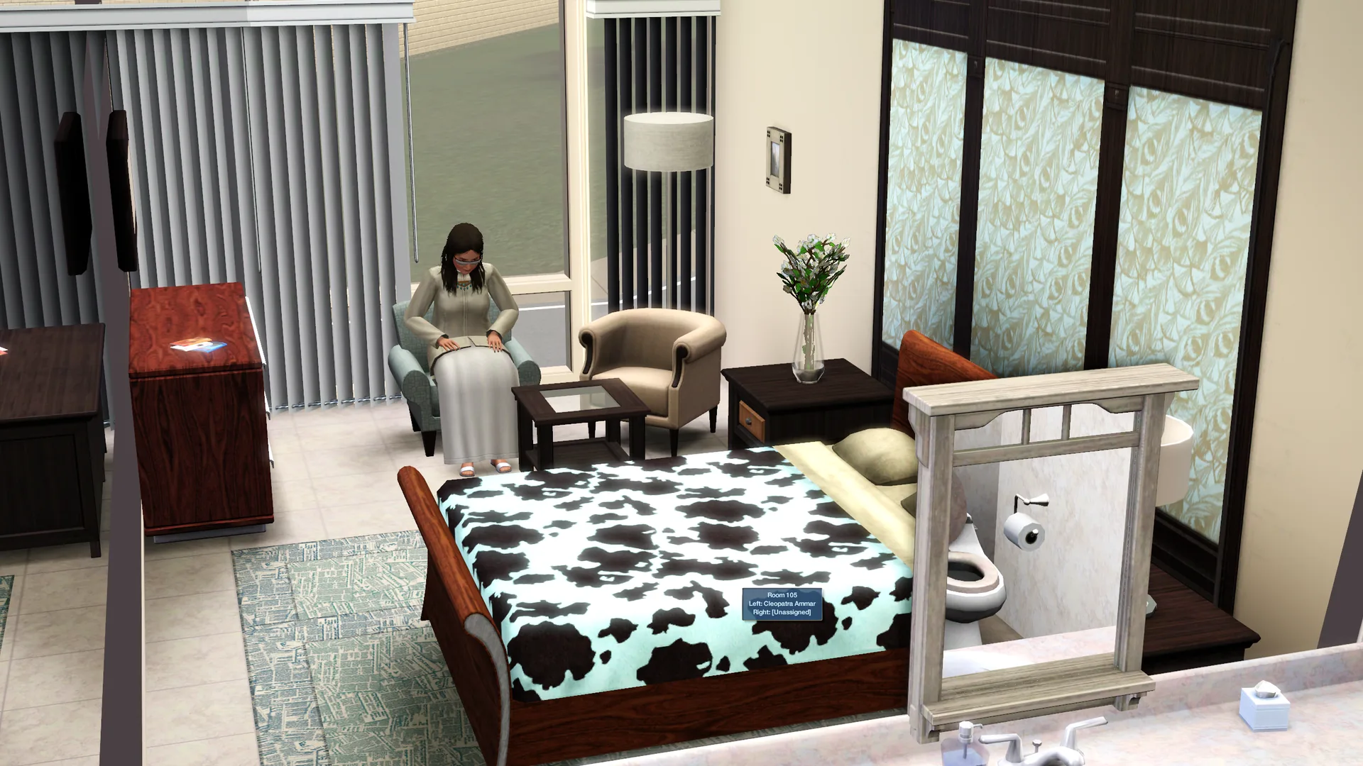 A furnished guest room with a tooltip reading Room 105, left bed assigned to Cleopatra Ammar and the right bed unassigned.